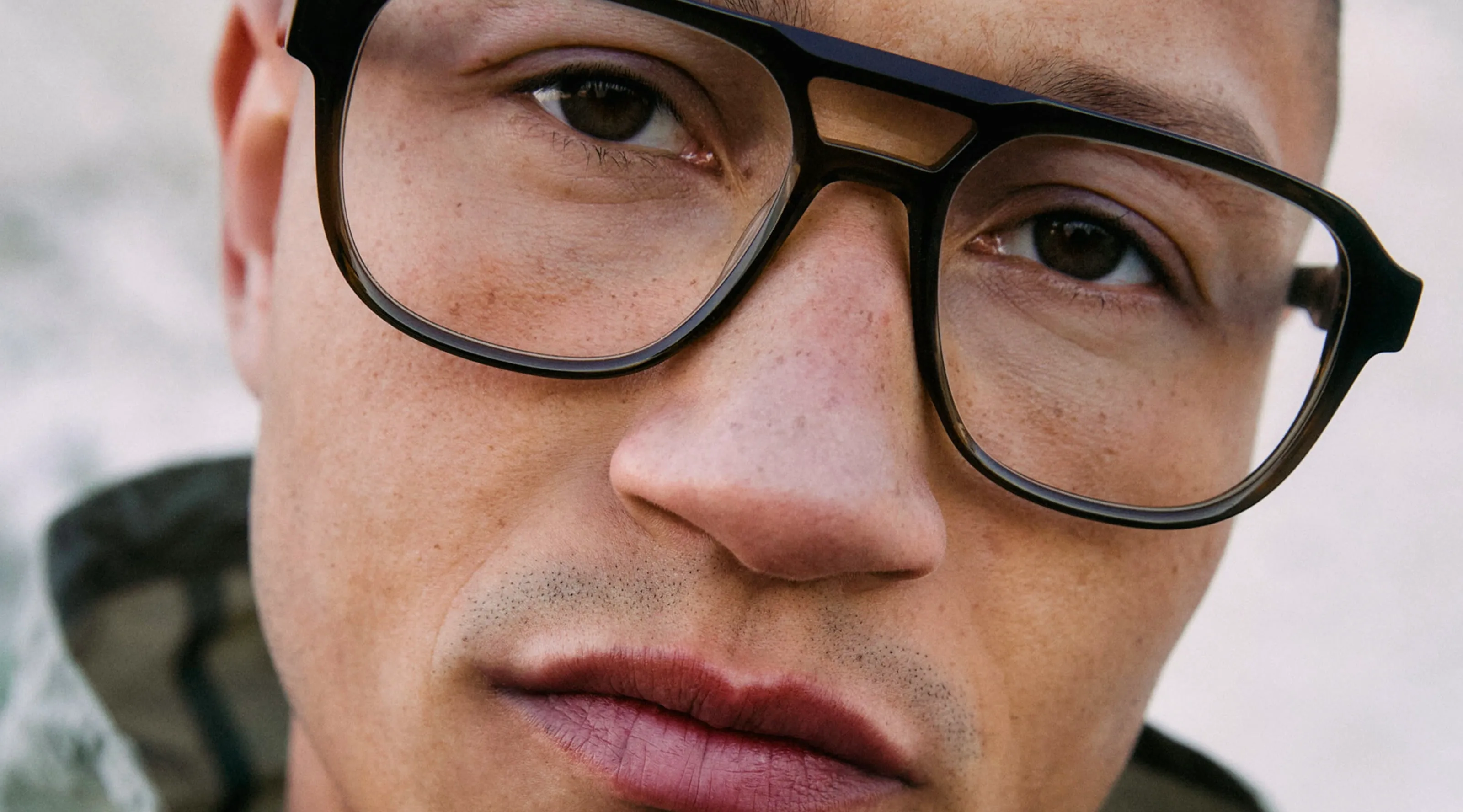 Ørgreen Optics campaign portrait: a man in glasses with dark frames
